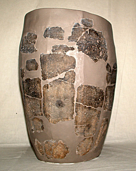A pot with gap fills painted in a pale brown colour A pot with gap fills painted in a pale brown colour