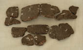 Some fragments of pot on a pale background Some fragments of pot on a pale background