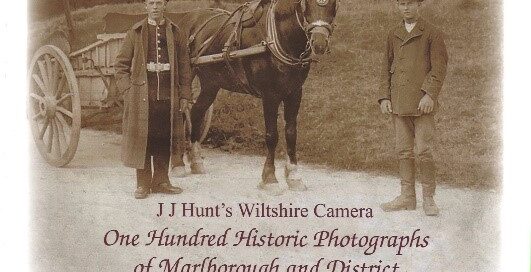 The book cover of JJ Hunt's Wiltshire Camera with archive photo of two men, one in uniform, standing by a horse and cart.