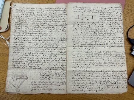 Double page open document with italic hand interspersed with small drawings 