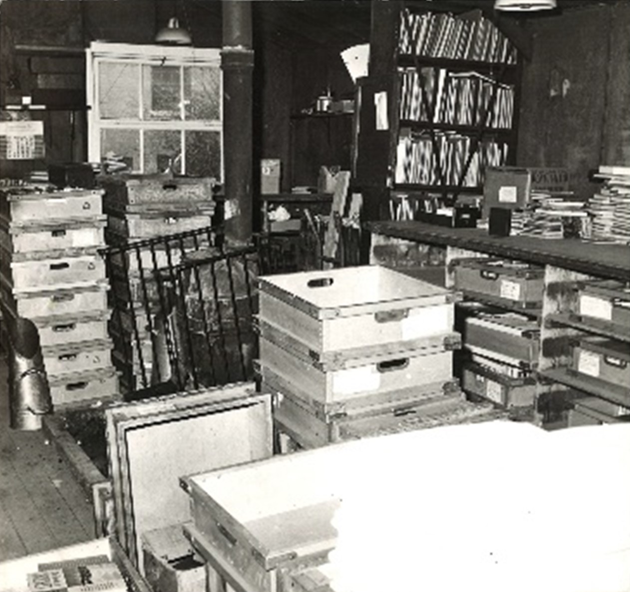 A view of piled boxes and full shelves