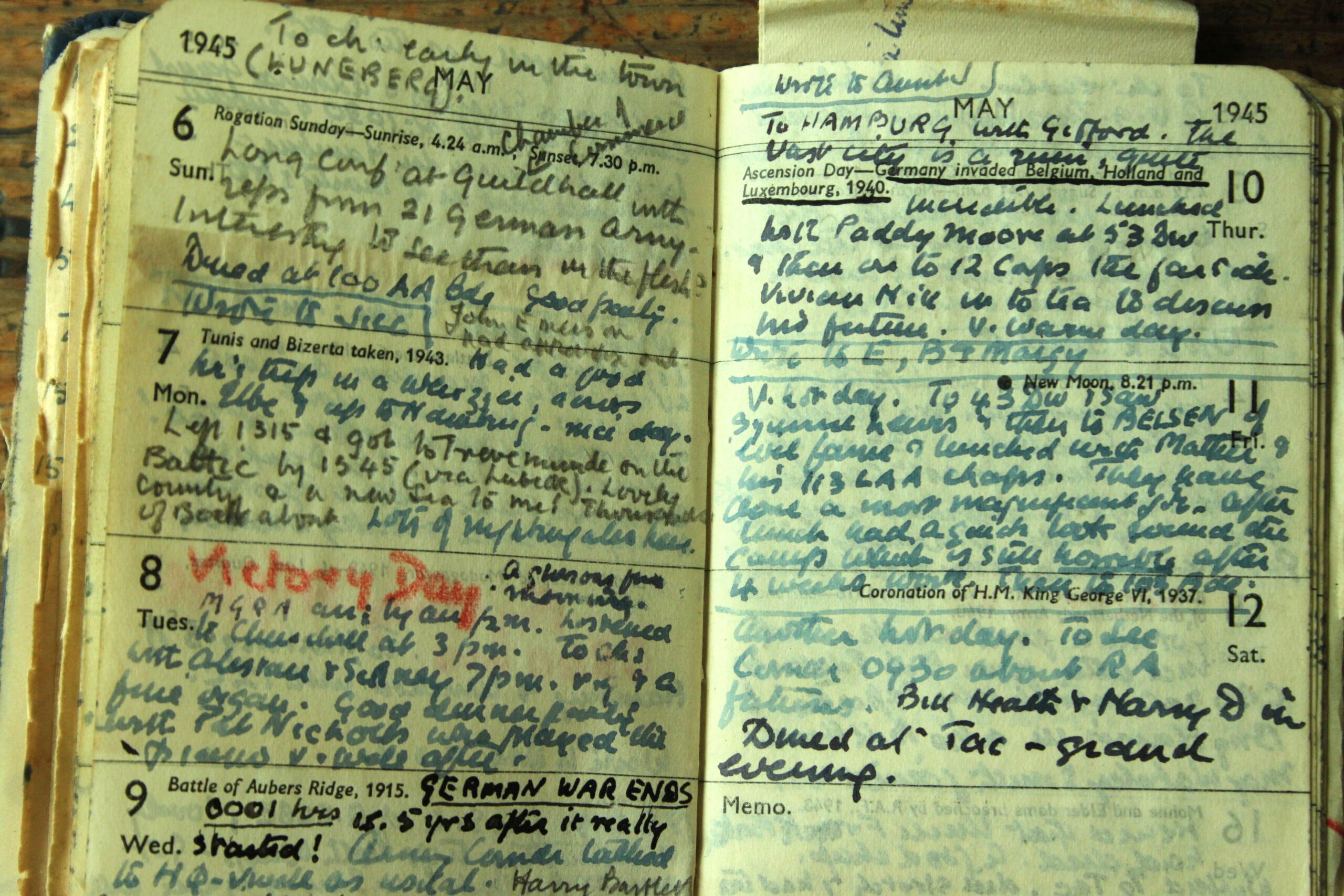 Double page diary entry with multiple days of writing - Victory Day written in red on 8 May.