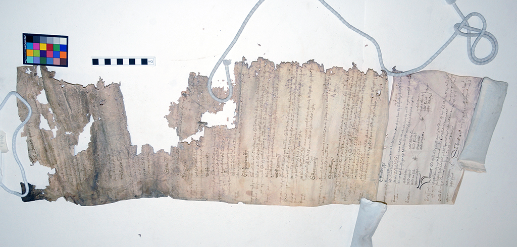 A picture of one of the court rolls before conservation. It has extensive damage.