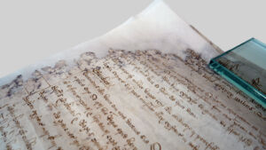 A close-up of a repaired corner on one of the conserved court roll pages