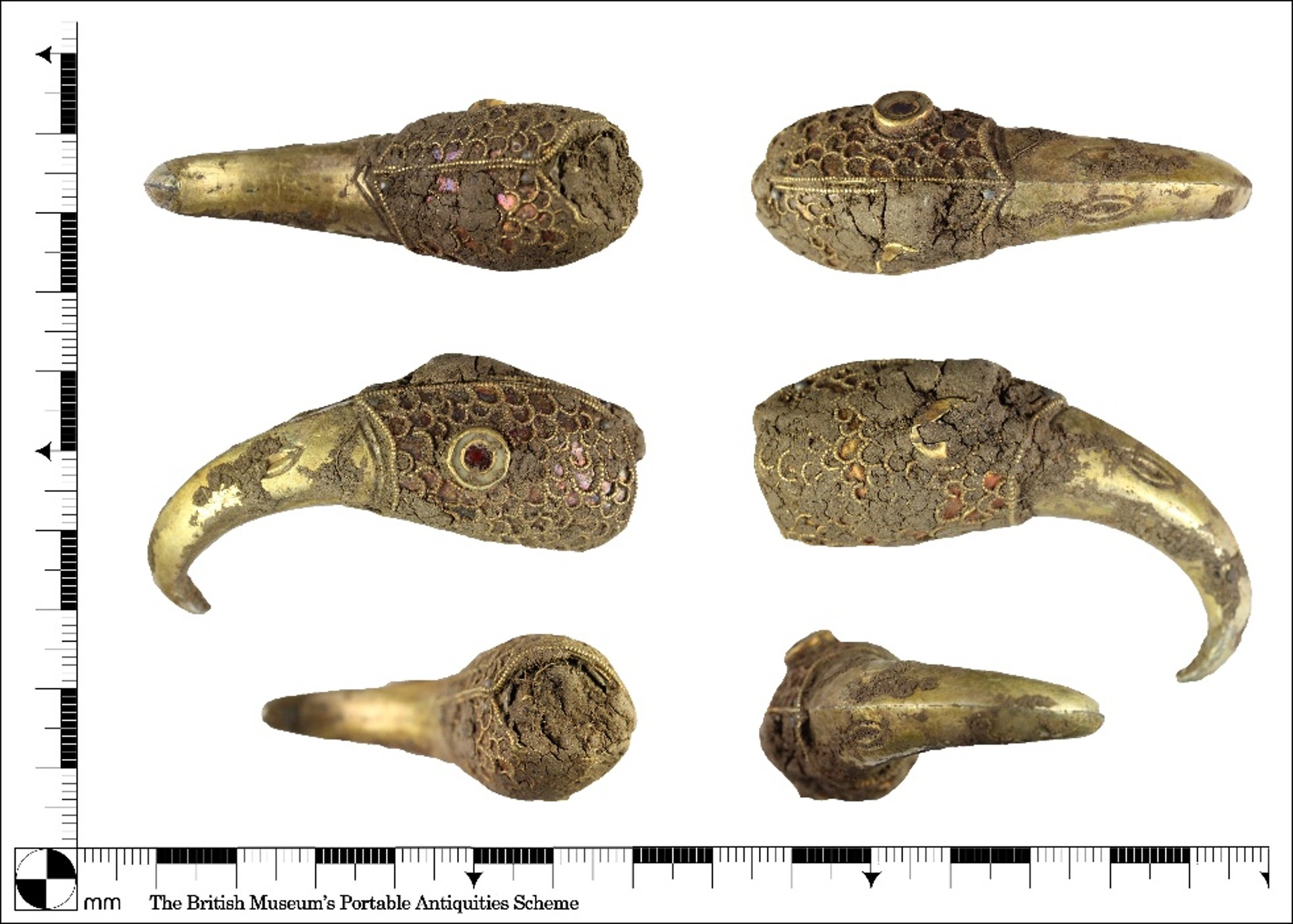 Scale view showing different aspects of gold bird head with ornate carved feather, long curved beak and inlaid gems.